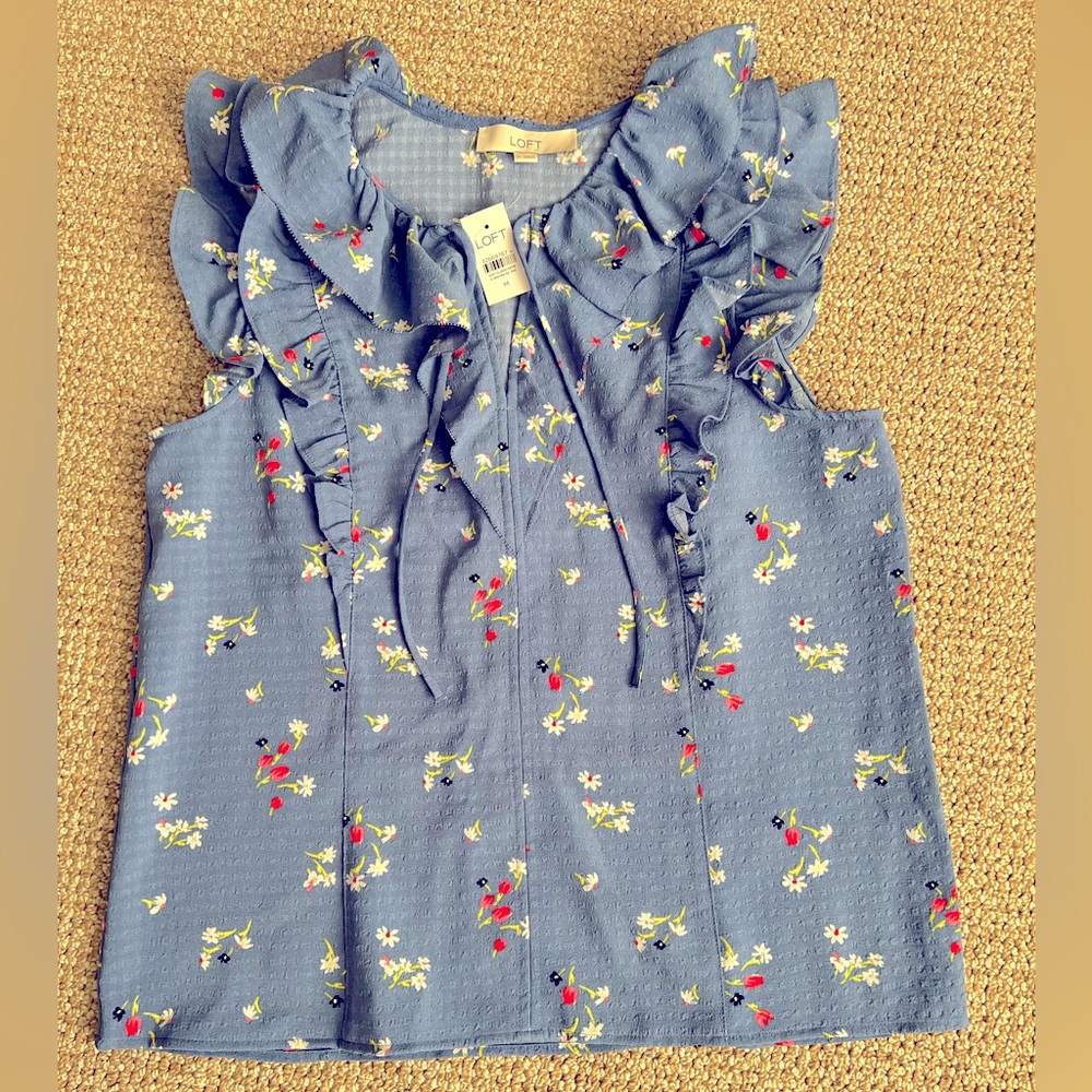 Ruffled sleeveless blouse